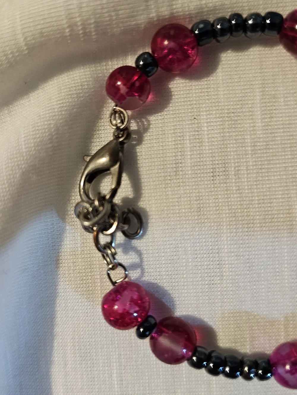 Bright Pink Beaded Bracelet with Dark Accent Beads With Paw Charm